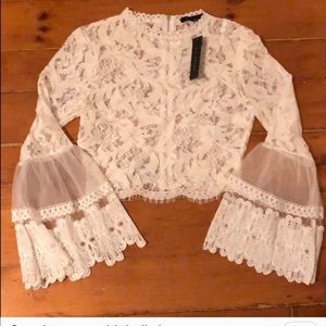 Lace mock neck top with bell sleeve